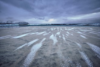 Rocky coast of fjord of Norwegian sea in winter. Skagsanden beach