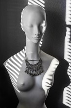 White fashion doll with oriental silver jewellery