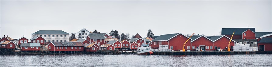 Panorama of Reine fishing village on Lofoten islands with red rorbu houses