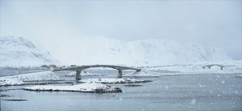Fredvang bridges in heavy snowfall in winter. Lofoten islands