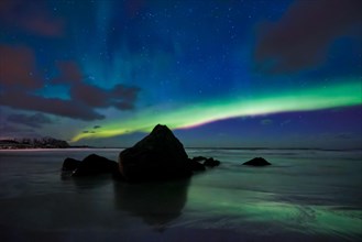 Aurora borealis northern lights on Skagsanden beach. Lofoten Islands
