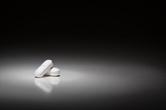 Hydrocodone prescription pills under spot light
