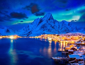 Reine village illuminated at night with Aurora Borealis. Lofoten islands