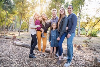 Multigenerational mixed-race family portrait outdoors