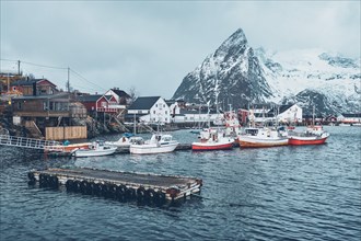 Pier with ships in Hamnoy fishing village on Lofoten Islands