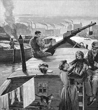 Familie auf einem Lastkahn auf der Spree vor Berlin