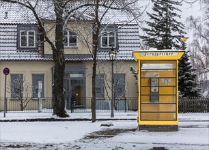 Nostalgic telephone box in winter