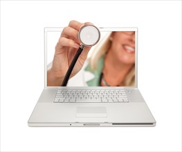 Female doctor holding stethoscope through laptop screen isolated on a white background