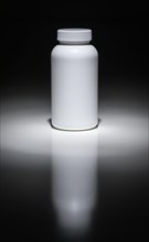 Blank white bottle ready for your text under spot light