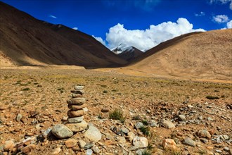 Stone cairn at Namshang La pass in Himalayas. Ladakh
