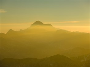 Peak of Triglav in the morning mist