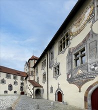 Partial view of courtyard of Hohes Schloss Fuessen with top right sundial