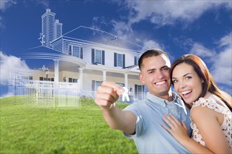 Happy military couple holding house keys with ghosted house drawing