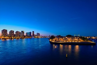 Rotterdam Noordereiland on Nieuwe Maas river island on illuminated at night. Rotterdam