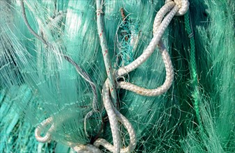 Green fishing net with dew