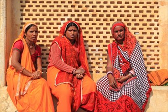 Three Indian woman in traditional dress