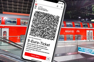 9-euro ticket on the mobile phone with regional train Photo montage in Berlin