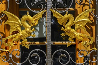 Two golden dragons at the entrance gate
