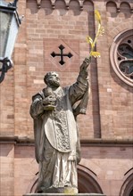 Sculpture of the patron saint Marcellinus in front of the Einhard Basilica of St. Marcellinus and Peter