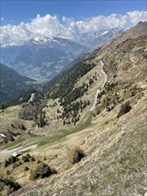 View from pass summit of mountain pass Jaufenpass to south ramp with southern ascent