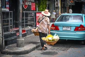 Thai woman selling fruit on the street