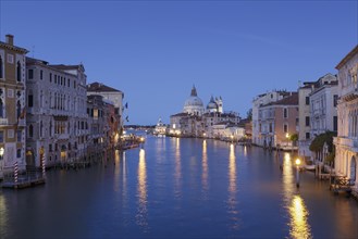 View of Venice with the Grand Canal and Basilica Santa Maria della Salute at dusk