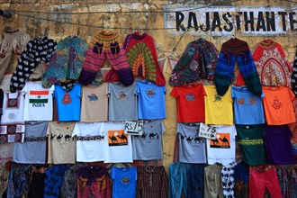 Colourful trousers and T-shirts as souvenirs at a stall