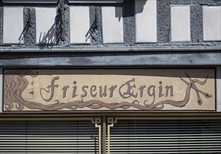 Writing on the house of a hairdresser
