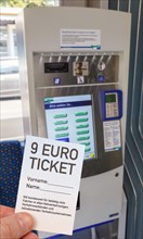9-euro ticket with ticket vending machine photo montage in Kassel