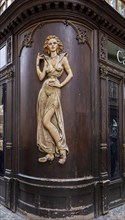 Decorative wood panelling on a shop in Prague