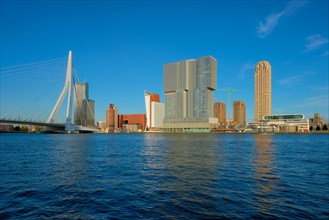 View of Rotterdam skyscrapers skyline and Erasmusbrug bridge view over of Nieuwe Maas river
