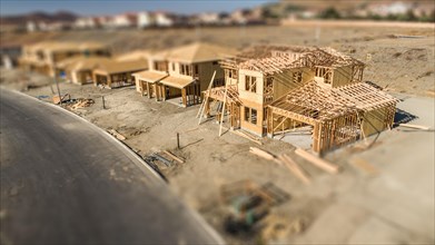 Aerial view of new homes construction site with tilt-shift blur