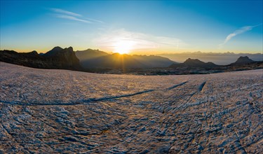 Aerial view over the Zanfleuron glacier with rising sun