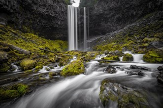 Waterfall cascading over rocky outcrop