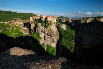 Monastery of Varlaam and Monastery of Rousanou in famous greek tourist destination Meteora in Greece on sunset with scenic scenery landscape