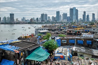 View of Mumbai skyline with skyscrapers over slums in Bandra suburb. Mumbai