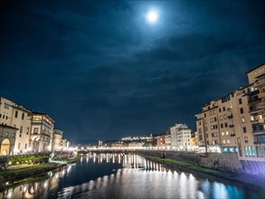 Full moon over the river Arno