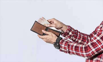 Man taking money out of his wallet