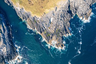 Top Down view over Geodha Smoo and Smoo Cave Cliffs from a drone