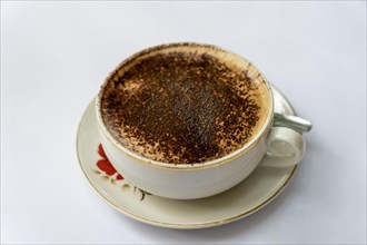 Top view of a cappuccino in an old fashioned cup