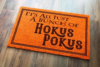 It's all A bunch of hokus pokus halloween orange welcome mat on wood floor background