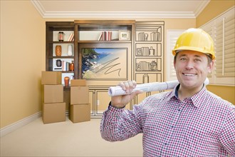 Male construction worker wearing hard hat in room with drawing of entertainment unit on wall