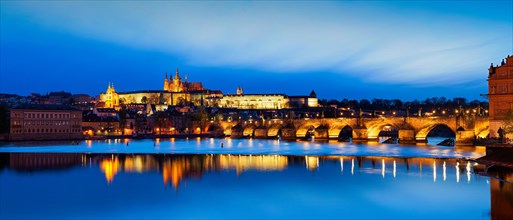 View of famous Charles Bridge and Prague Castle at blue hour