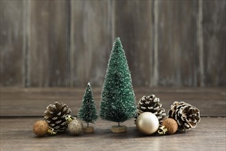 Arrangement with christmas trees pine cones