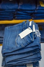 Close up of blue jeans on others with copy space
