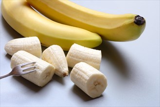 Bananas and banana pieces with fork