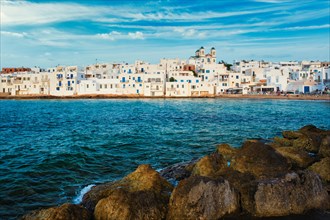 Picturesque view of Naousa town with greek orthodox church in famous tourist attraction Paros island