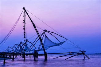 Kochi chinese fishnets on sunset in Fort Kochin