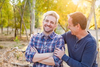 Happy caucasian father and son portrait outdoors