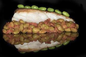 Fried fillet of cod with a ragout of Japanese edamame beans and tomatoes